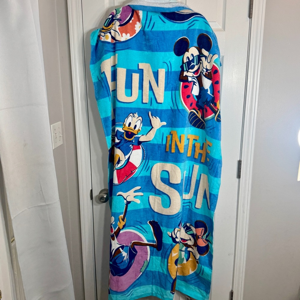NWT. Disney beach towel featuring Mickey Mouse and others. “FUN IN THE SUN"